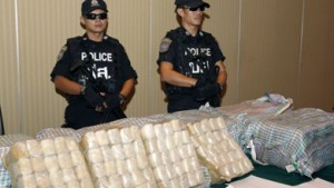 Thai policemen with about 2 million methamphetamine pills produced in North Korea.  /AP/Sakchai Lalit