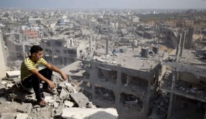 A Palestinian man looks out over destruction in part of Gaza City's al-Tufah neighborhood.