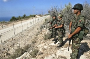 Lebanese soldiers near the Israel border fence.