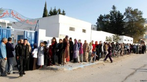 Tunisians line up to vote on Oct. 26.