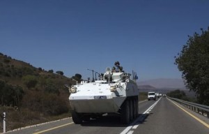 U.N. Disengagement Observer Force (UNDOF) vehicles leaving Golan Heights for Israel on Aug. 28. / Ronen Zvulun /  Reuters 