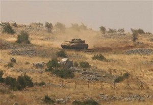An Israeli tank patrols the Shebaa area near the Lebanon border.  /Reuters