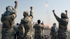 Iran's Islamic Revolutionary Guard Corps celebrate the launching a missile in July 2012. / Mostafa Qotbi / AP/IRNA