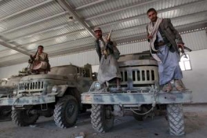 Iran-backed Houthi Shi'ite rebels with military vehicles captured at an army base in Sanaa on Sept, 22. / Mohammed Huwais /AFP