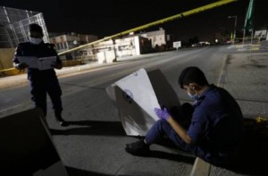 Police at crime scene of bombing attack that killed a police officer in Damistan, Bahrain on Dec. 8. / Hamad I Mohammed / Reuters