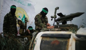 Hamas members with weapons on parade in Gaza City this week. / Reuters