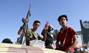 Militants in truck mounted with anti-aircraft guns at Tripoli airport in August.   Hamza Turkia / Xinhua Press / Corbis