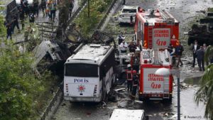 Fire engines stand beside a Turkish police bus which was targeted in a bomb attack in Istanbul. /Reuters