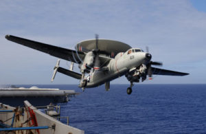 U.S. Adm. John Richardson boarded an E-2C from the carrier USS Stennis to inspect disputed South China Sea area.