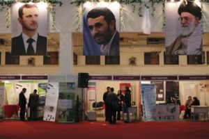 From left, Syrian President Bashar Assad, Iran's then-President Mahmoud Ahmadinejad and Iran's Supreme Leader Ayatollah Ali Khamenei at a technology expo near Damascus, Feb. 9, 2011. / Reuters
