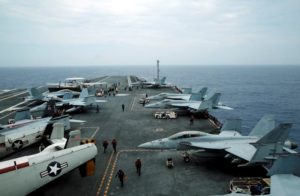 F/A-18 Hornet fighter jets and E-2D Hawkeye plane are seen on the U.S. aircraft carrier John C. Stennis during joint military exercise called Malabar, with the United States, Japan and India participating, off Japan's southernmost island of Okinawa. /Reuters/Nobuhiro Kubo