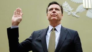 FBI Director James Comey is sworn-in before a House Oversight and Government Reform Committee hearing on July 7. /Yuri Gripas/AFP/Getty Images