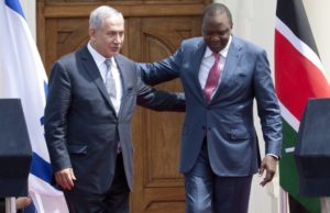 Prime Minister Binyamin Netanyahu (L) and Kenyan President Uhuru Kenyatta walk together after giving a joint press conference at State House in Nairobi, Kenya on July 5. /AP/Sayyid Abdul Azim