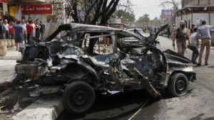 At least two people were killed and seven wounded in a nighttime car bomb attack targeting a security chief in Benghazi on July 3.