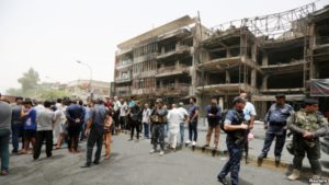 Iraqis near site of blast in Baghdad's Karrada shopping mall. / Reuters