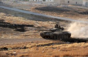 Syrian opposition fighters drive a tank on the southern outskirts of Aleppo. /AFP