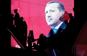 Supporters of Turkey's Erdogan silhouetted against a screen with his image. / Baz Ratner / Reuters