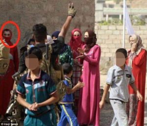 ISIL's Abu Omar al-Assafi, circled, was caught trying to sneak out of an Iraqi town in drag. /Iraqi News