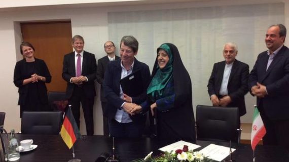 Iran minister causes uproar by shaking hands with female German official
