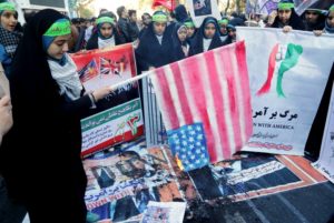 An Iranian youth burns home-made American flag outside the former U.S. embassy Teheran on Nov. 3. /AFP