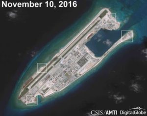 A satellite image shows what Asia Maritime Transparency Initiative says appears to be anti-aircraft guns and what are likely to be close-in weapons systems on the artificial island Fiery Cross Reef in the South China Sea in this image released on Dec. 13. /Courtesy CSIS Asia Maritime Transparency Initiative/DigitalGlobe/via Reuters