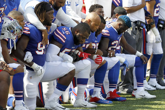 NFL and NBA have different rules for how high-paid athletes should respect national anthem