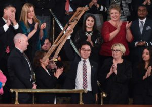 Riveting State of the Union moment: North Korean defector waves crutches in defiance