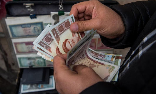 Iran’s currency falls to record low, discontent speads as U.S. sanctions loom