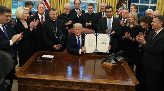 Trump signs legislation to help religious minorities in Iraq, Syria