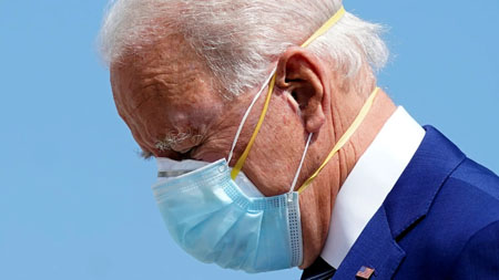 Biden says you must mask up — for the next year
