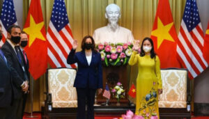 Meanwhile in Vietnam: Kamala Harris poses in front of statue of Ho Chi Minh